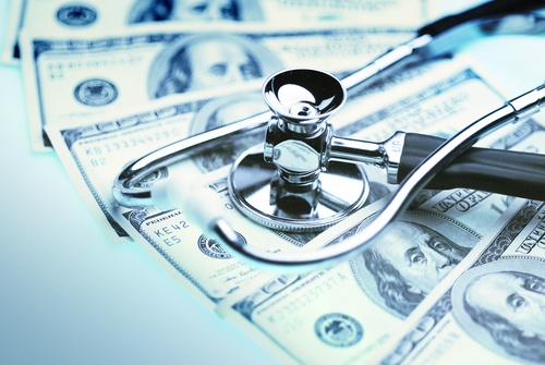 Integrated Healthcare | Stethoscope on Top of Cash